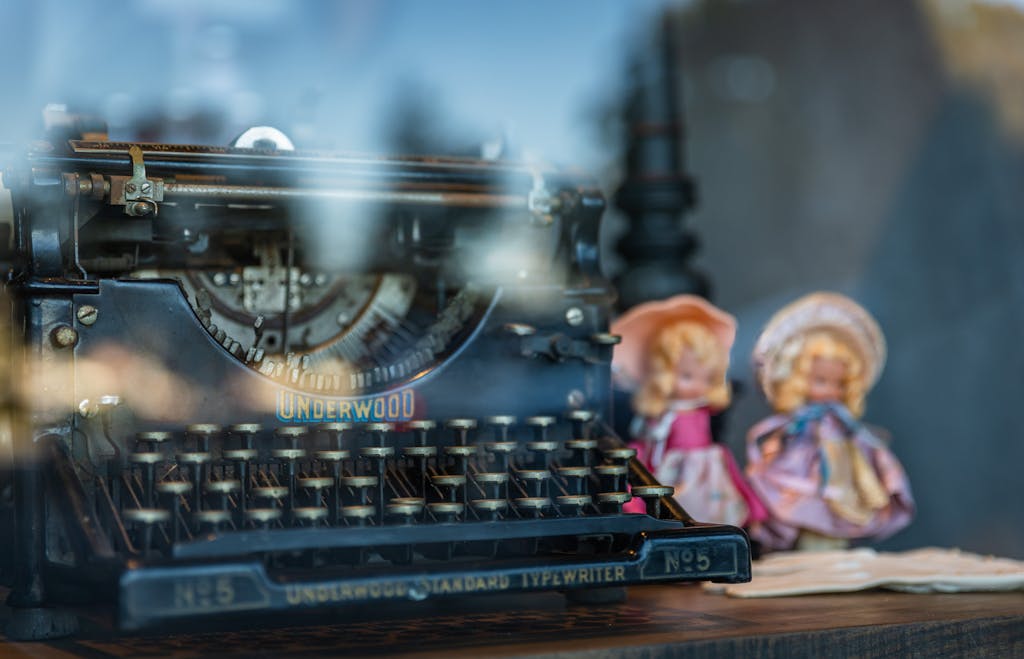 Typewriter and Dolls behind Window